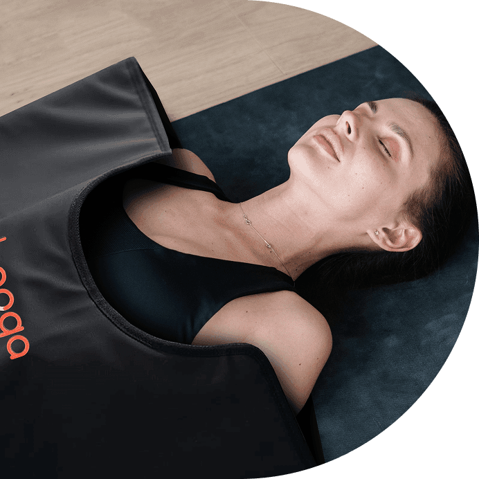 Woman using an infrared sauna blanket